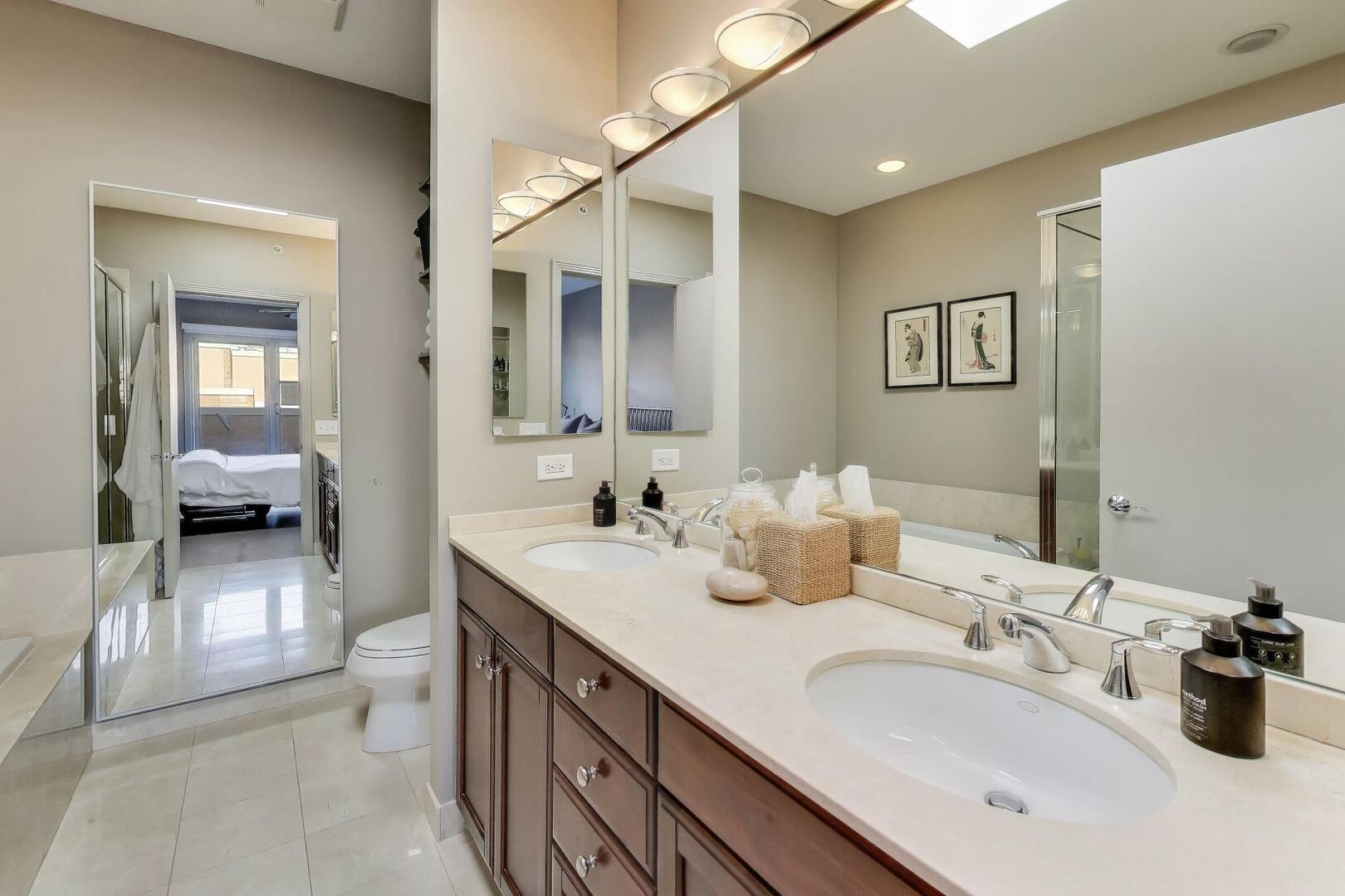 1137 West Monroe Street, Unit 9 Chicago, IL 60607 - Photo 24 of 31 a en suite bathroom with double sink and a mirror