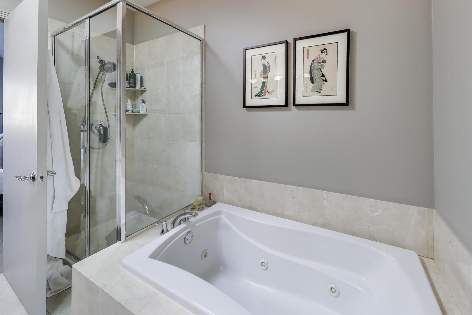 1137 West Monroe Street, Unit 9 Chicago, IL 60607 - Photo 25 of 31 a bathroom with a tub and shower