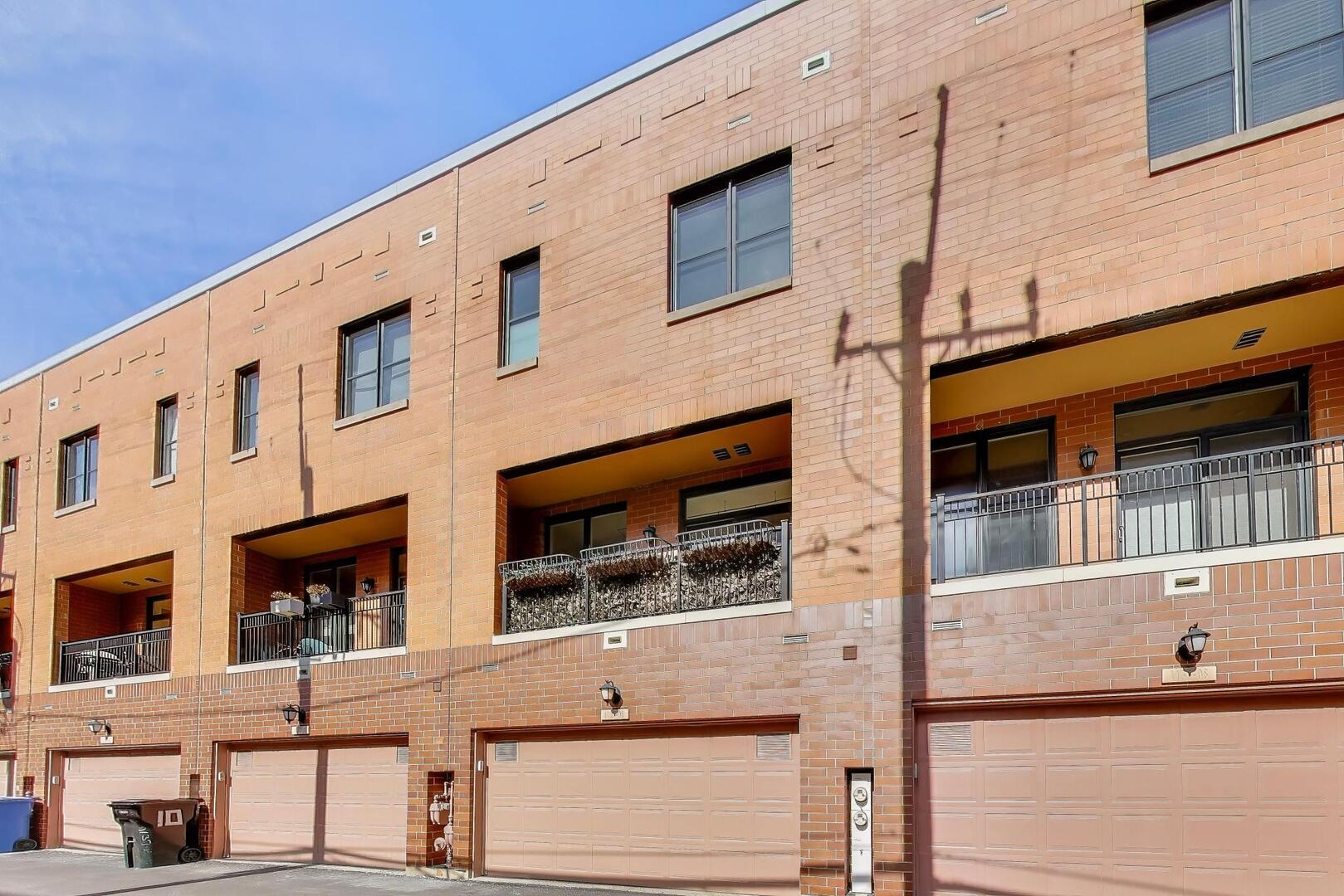 1137 West Monroe Street, Unit 9 Chicago, IL 60607 - Photo 31 of 31 a front view of a building with a couple of windows