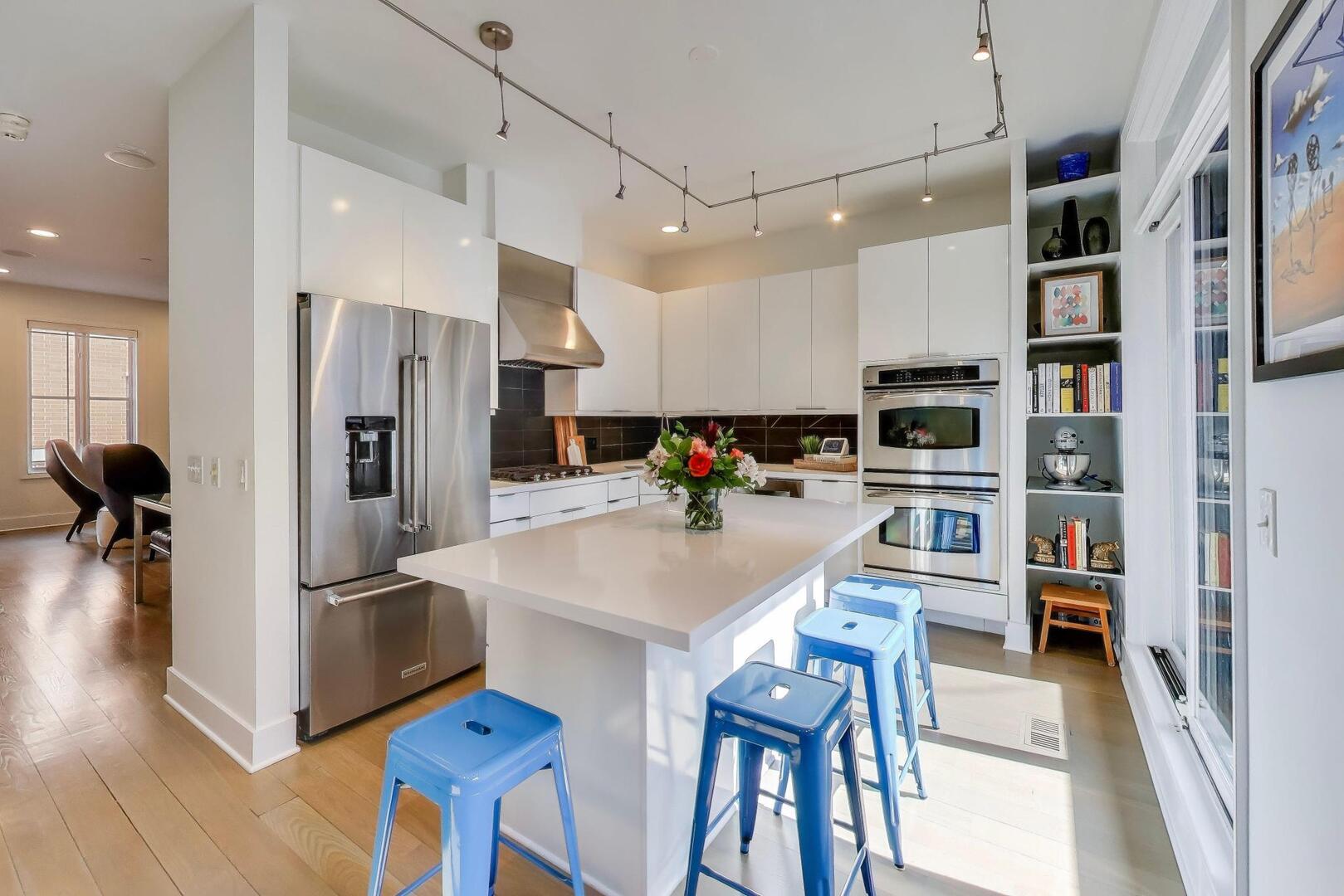 1137 West Monroe Street, Unit 9 Chicago, IL 60607 - Photo 6 of 31 a kitchen with stainless steel appliances a refrigerator and a stove