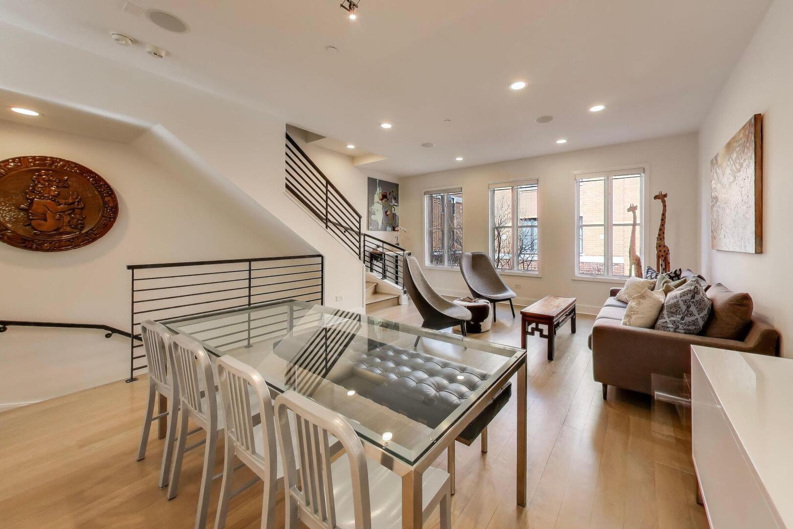 1137 West Monroe Street, Unit 9 Chicago, IL 60607 - Photo 10 of 31 a living room with furniture and a wooden floor