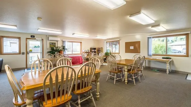 a view of a dining room with furniture window and outside view