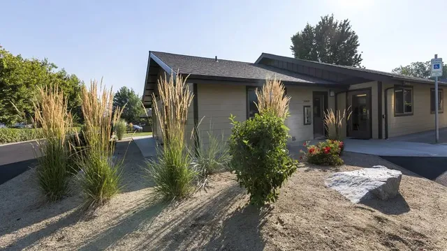 a front view of a house with garden