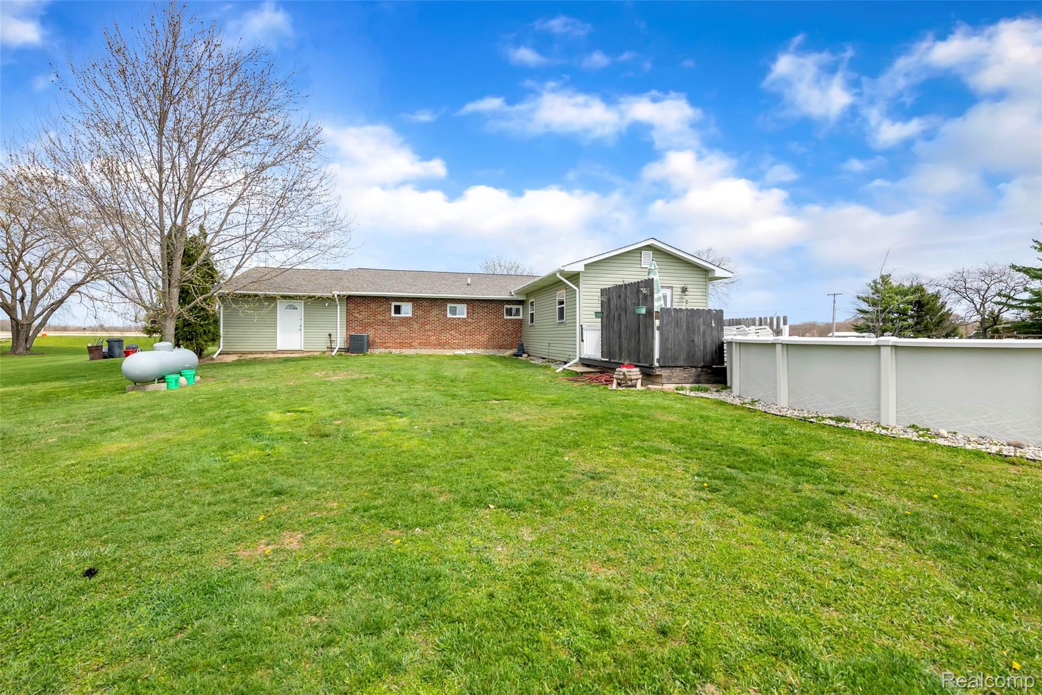 2185 Peet Road New Lothrop, MI 48460 - Photo 21 of 29 Enjoy the Summer Poolside
