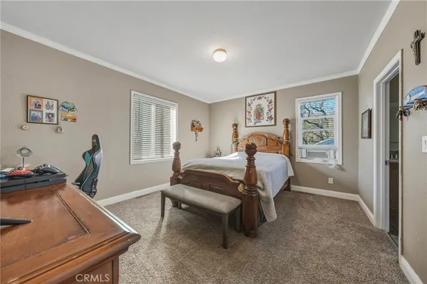 a bedroom with furniture and a window