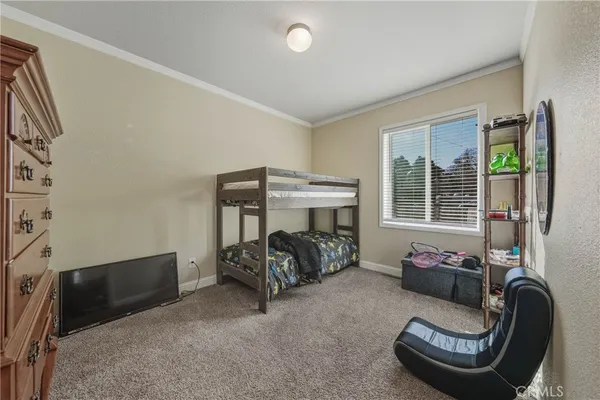 a bedroom with furniture and a window