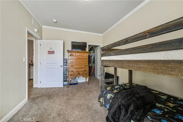 a bed room with a bed and a desk