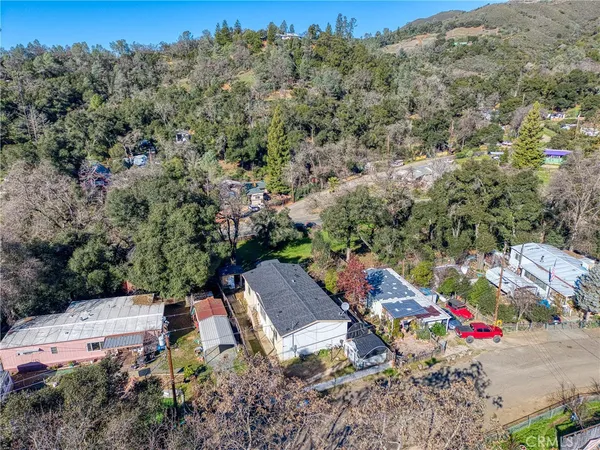 an aerial view of a houses with outdoor space