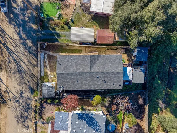 an aerial view of residential houses with outdoor space