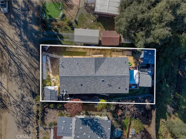 a view of house with a yard and sitting area