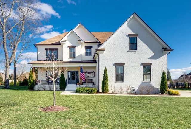 a view of a house with a yard and plants