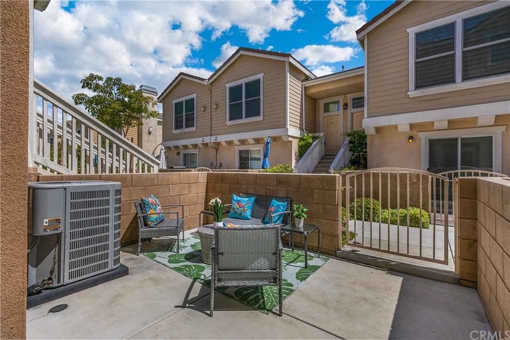 9016 Kimberly Ln. Cypress, CA 90630 - Photo 18 of 21 a balcony with table and chairs