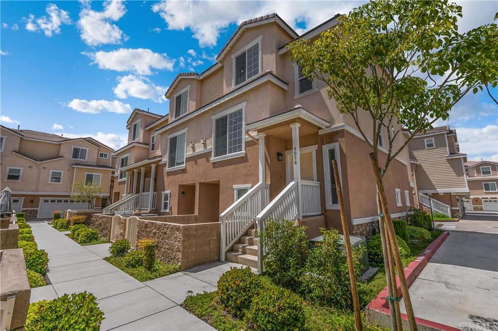 9016 Kimberly Ln. Cypress, CA 90630 - Photo 2 of 21 a front view of a house with a garden
