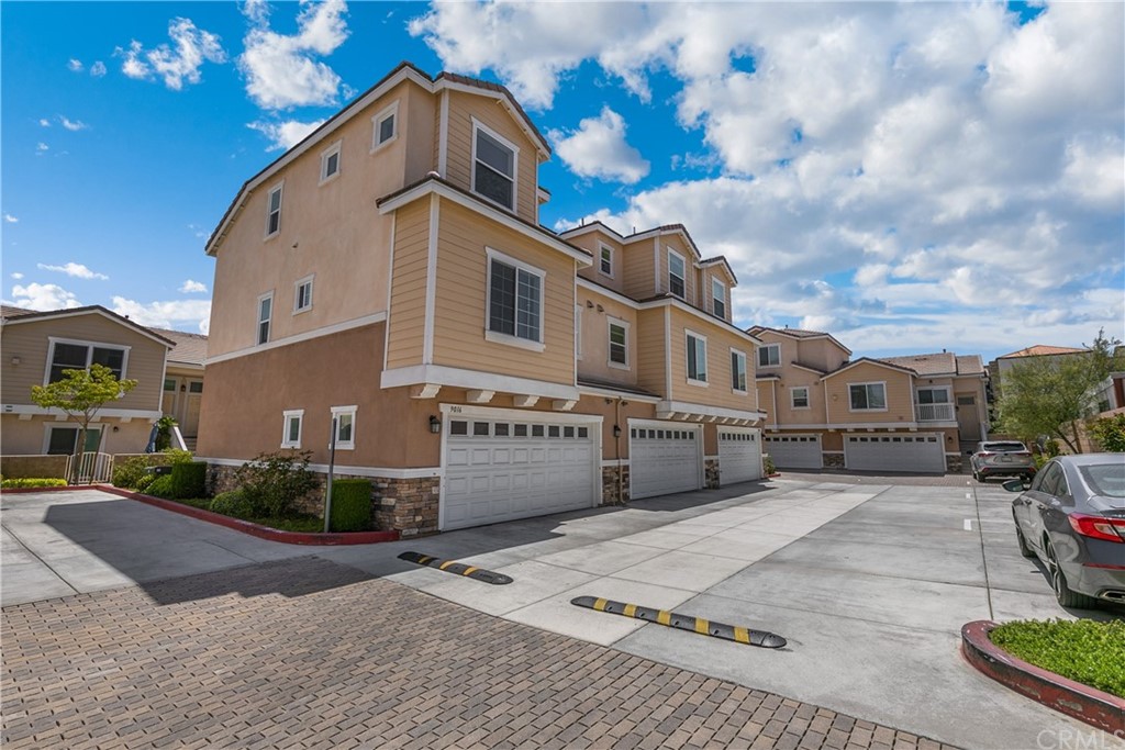 9016 Kimberly Ln. Cypress, CA 90630 - Photo 21 of 21 a front view of a house with a yard and garage