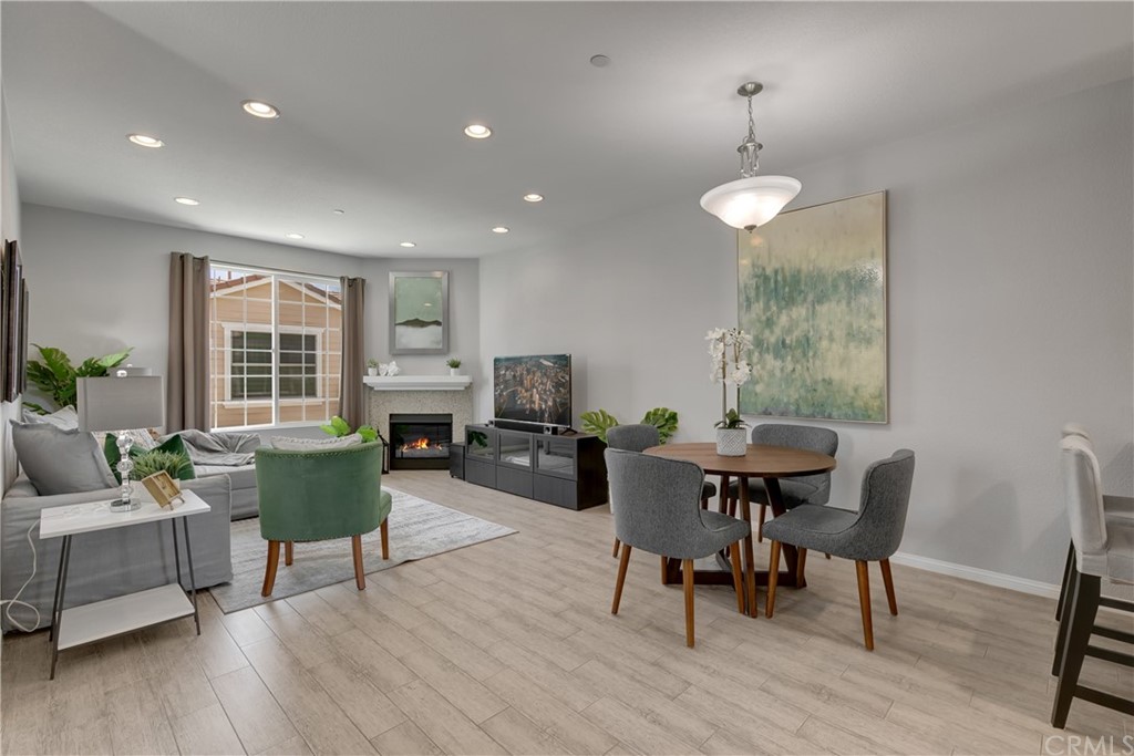 9016 Kimberly Ln. Cypress, CA 90630 - Photo 4 of 21 a view of a dining room with furniture window and wooden floor