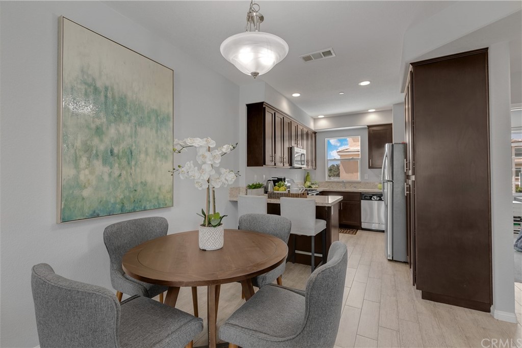 9016 Kimberly Ln. Cypress, CA 90630 - Photo 5 of 21 a view of a dining room with furniture