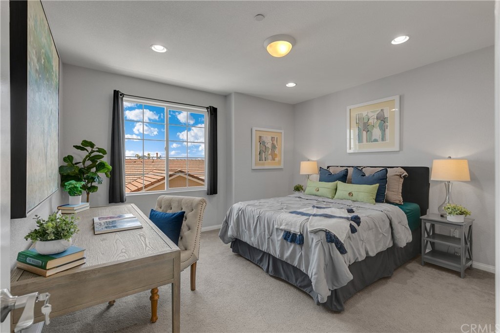 9016 Kimberly Ln. Cypress, CA 90630 - Photo 7 of 21 a spacious bedroom with a bed and a table