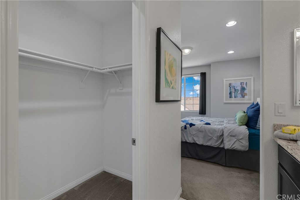 9016 Kimberly Ln. Cypress, CA 90630 - Photo 9 of 21 a bedroom with furniture and a ceiling fan