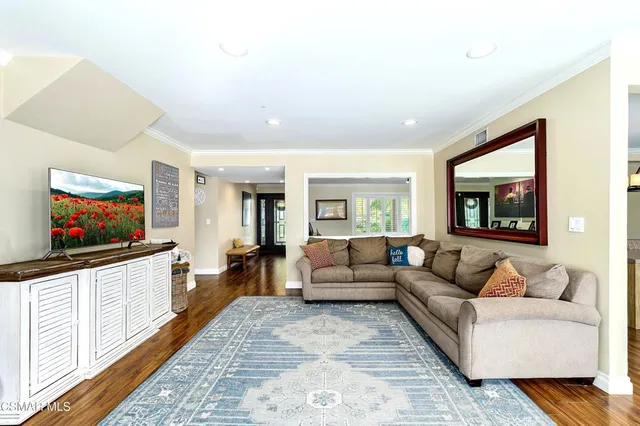 a kitchen with stainless steel appliances granite countertop a sink a stove and cabinets