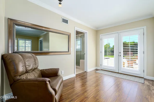 a bathroom with a sink mirror and vanity