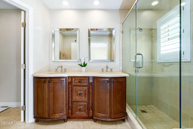 a bedroom with a bed and a wooden floor