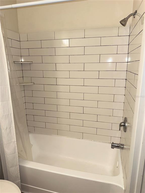 1550 South Belcher Road, Unit 335 Clearwater, FL 33764 - Photo 11 of 21 a bathroom with a bathtub and shower