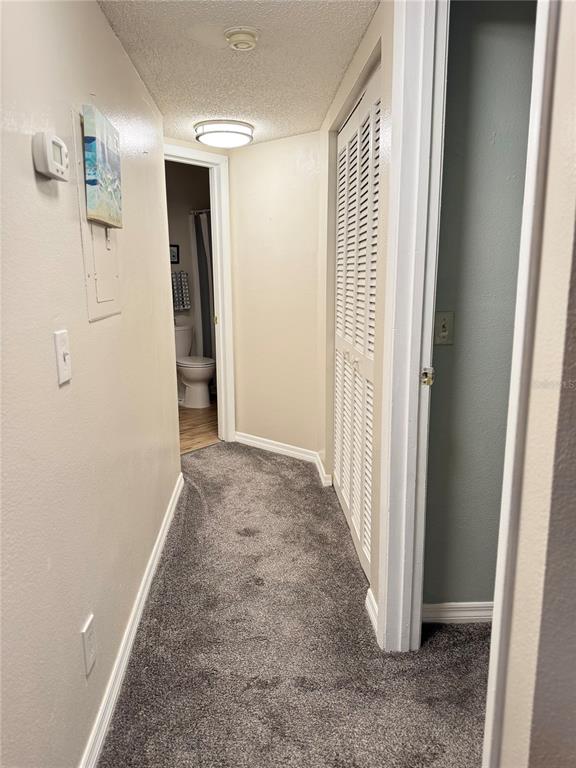 1550 South Belcher Road, Unit 335 Clearwater, FL 33764 - Photo 15 of 21 a view of a hallway with wooden floor and entryway