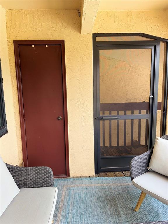 1550 South Belcher Road, Unit 335 Clearwater, FL 33764 - Photo 20 of 21 a view of wooden floor and chair