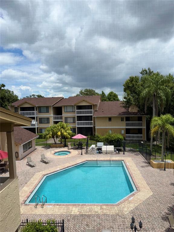 1550 South Belcher Road, Unit 335 Clearwater, FL 33764 - Photo 21 of 21 a view of swimming pool with outdoor seating