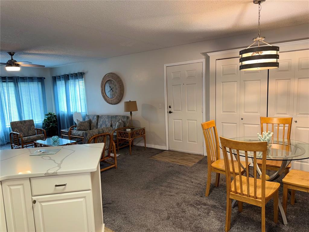 1550 South Belcher Road, Unit 335 Clearwater, FL 33764 - Photo 10 of 21 a view of a dining room with furniture