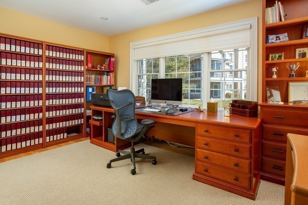 287 Langley Road, Unit 27 Newton, MA 02459 - Photo 11 of 17 a view of a workspace with furniture and a window