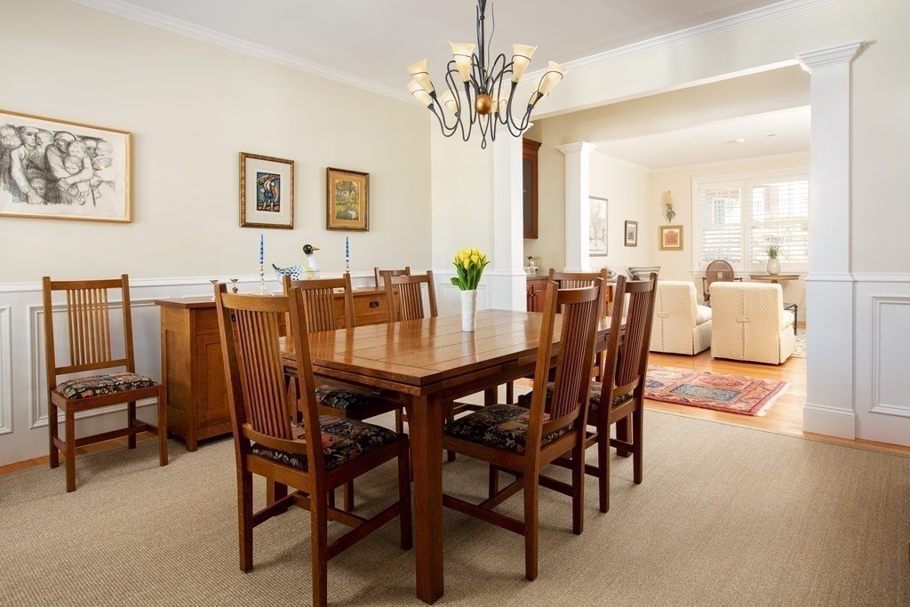 287 Langley Road, Unit 27 Newton, MA 02459 - Photo 2 of 17 a view of a dining room with furniture and a chandelier
