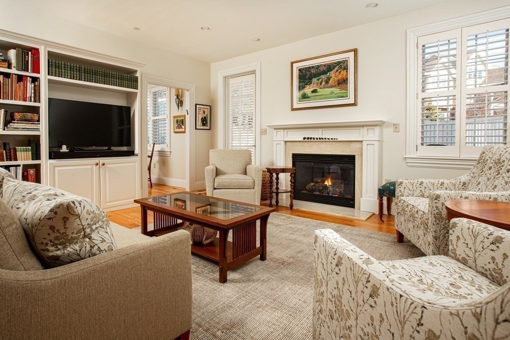 287 Langley Road, Unit 27 Newton, MA 02459 - Photo 4 of 17 a living room with furniture and a flat screen tv