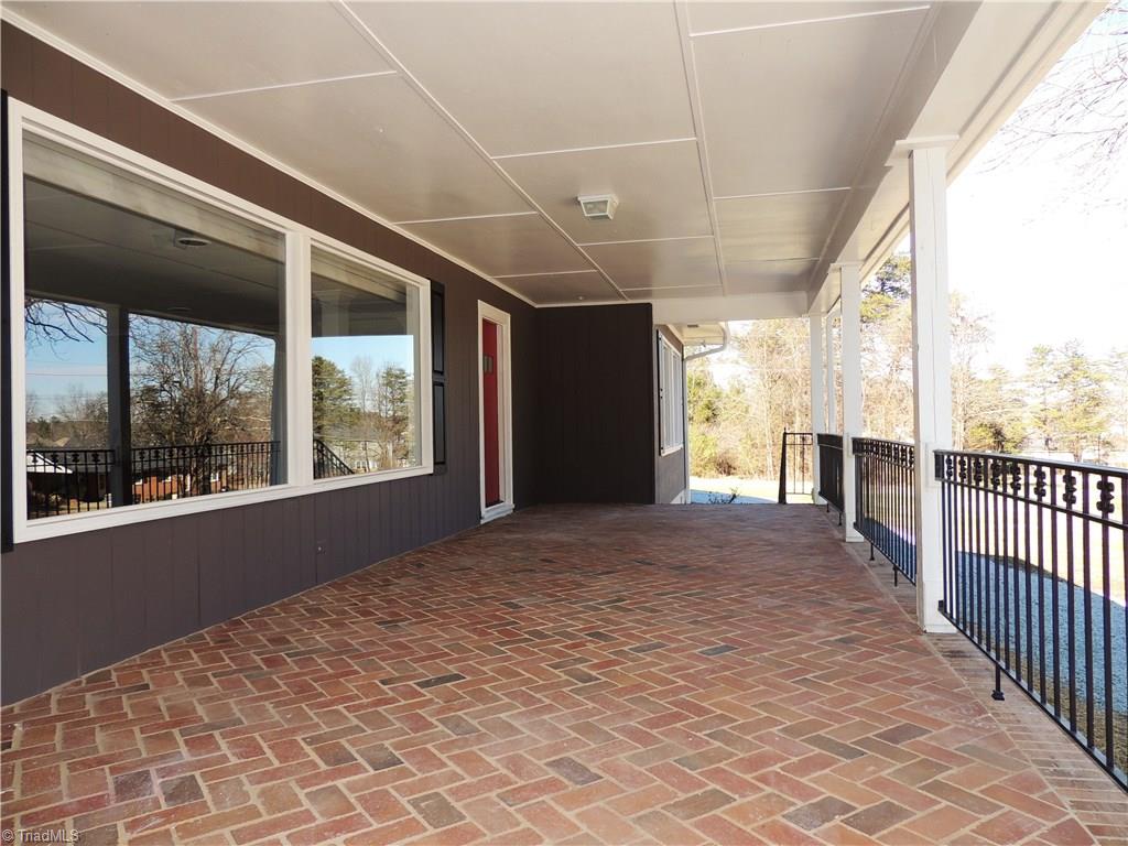 4017 Resthaven Road High Point, NC 27265 - Photo 3 of 29 Fantastic porch for rocking chairs!!
