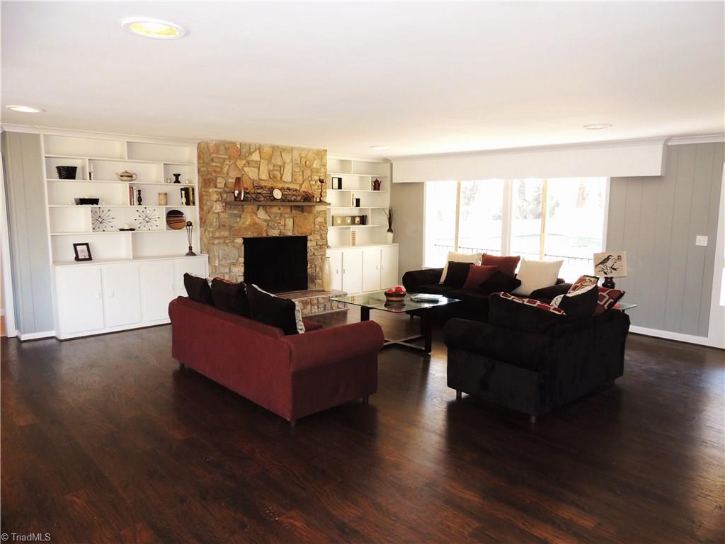 4017 Resthaven Road High Point, NC 27265 - Photo 4 of 29 The Great Room! Beautiful floors and built-ins add to the charm! Enjoy gathering by the stone fireplace! Large windows allow for lots of natural light!
