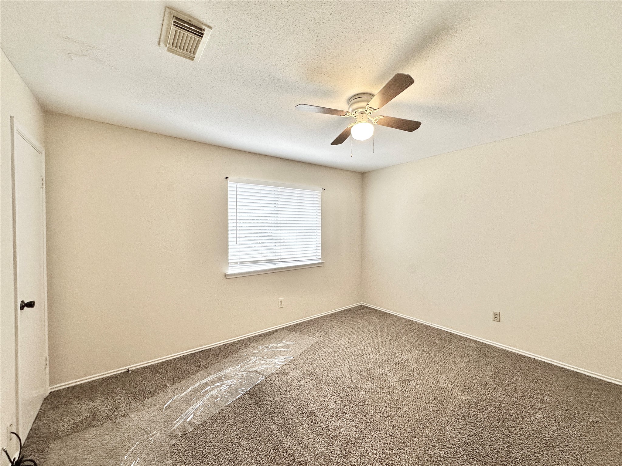16827 Ashbridge Court Spring, TX 77379 - Photo 14 of 20 a view of an empty room with a window