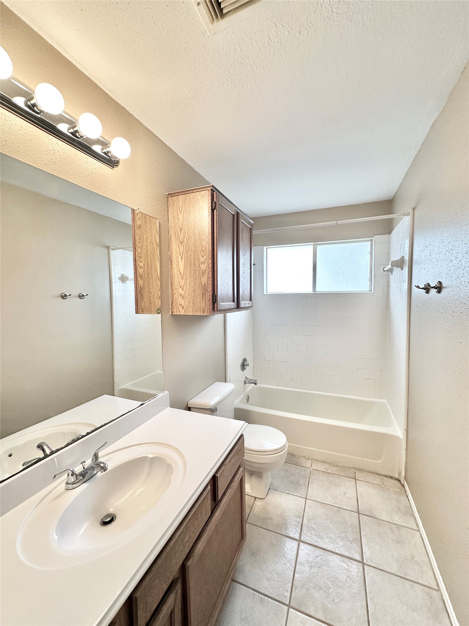 16827 Ashbridge Court Spring, TX 77379 - Photo 18 of 20 a bathroom with a sink a toilet and bathtub
