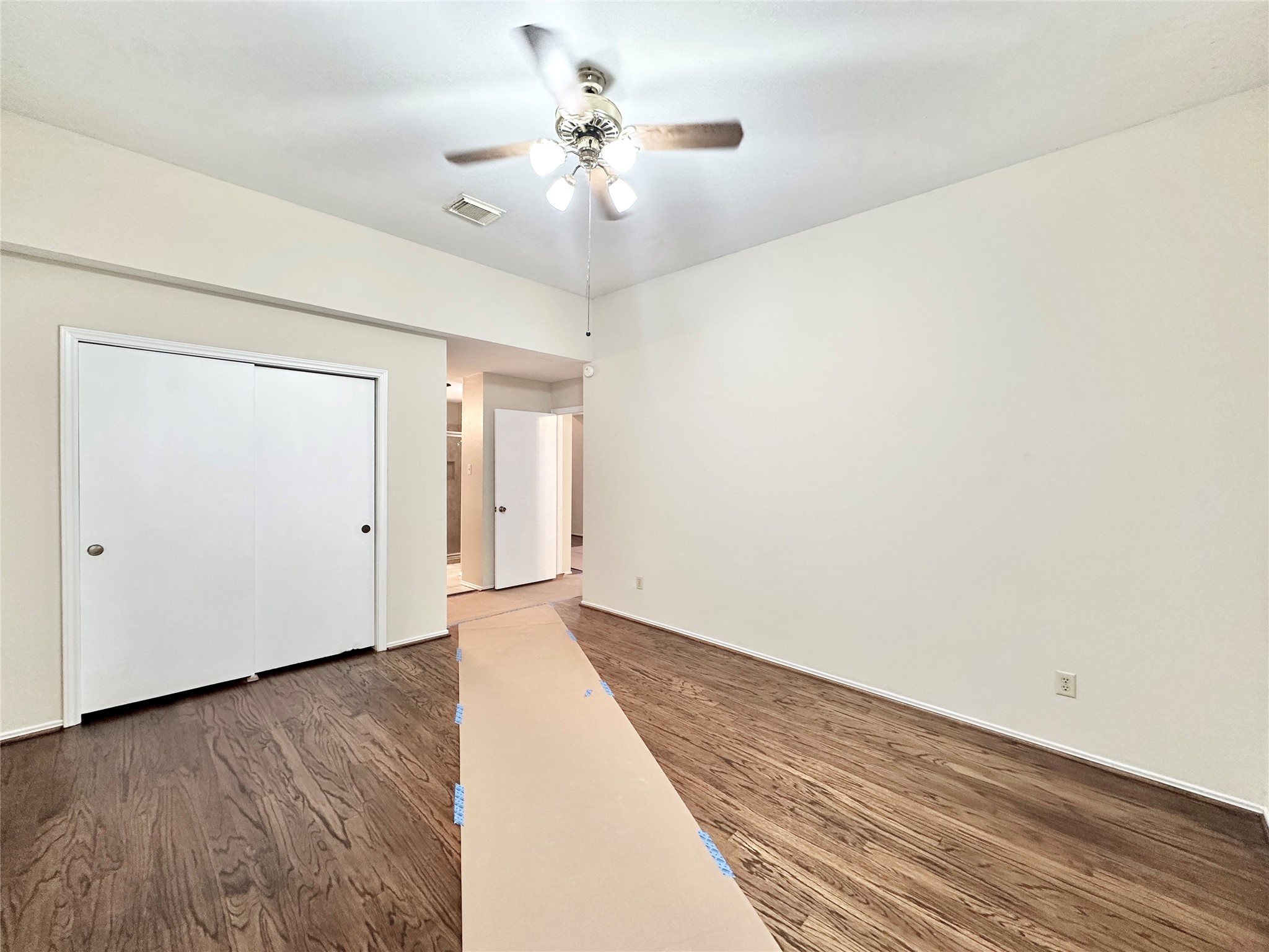 16827 Ashbridge Court Spring, TX 77379 - Photo 10 of 20 a view of an empty room with wooden floor