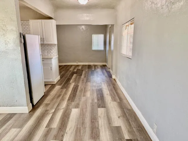 a front view of house with yard and trees