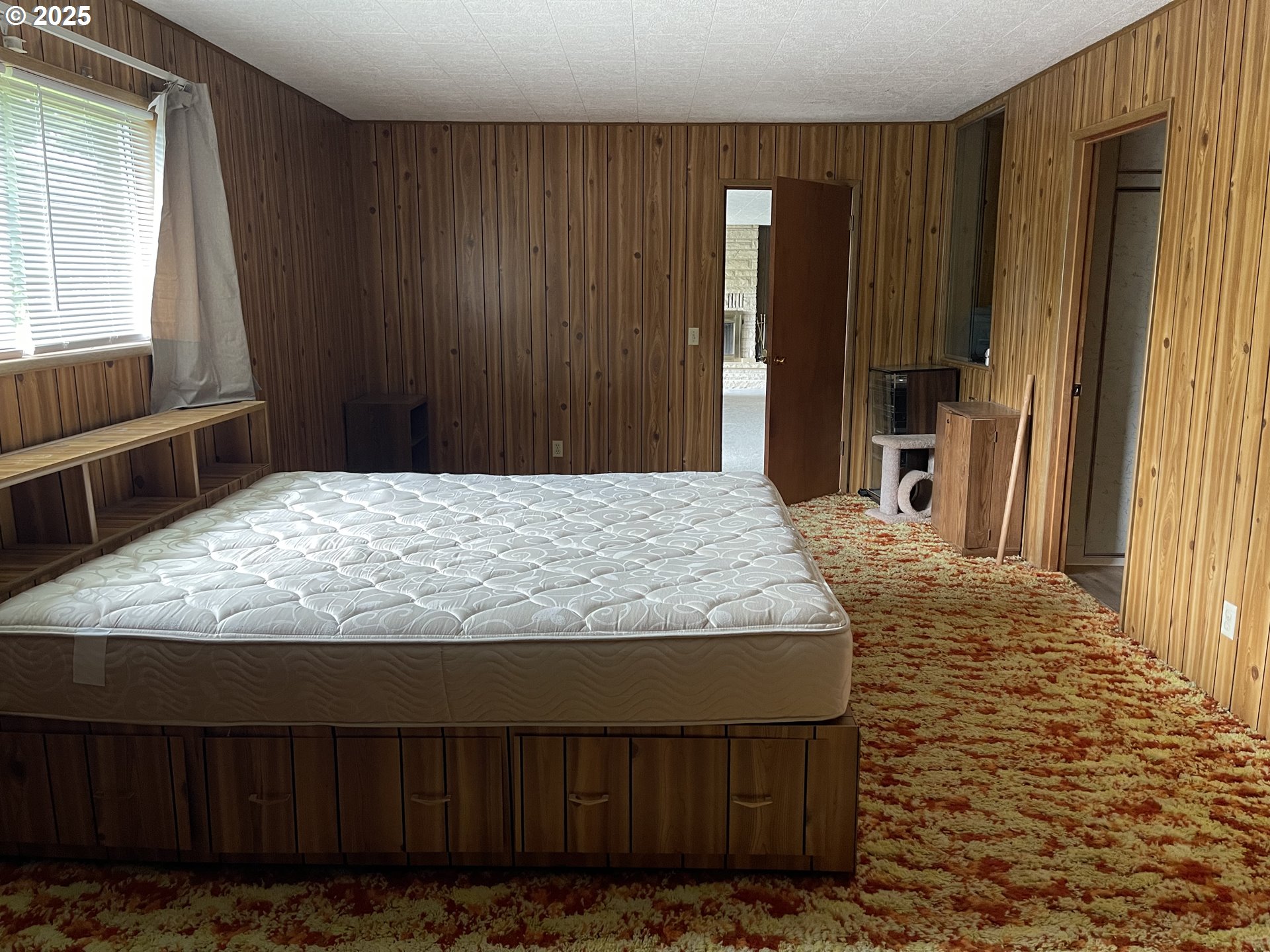 53610 Sourgrass Road Grand Ronde, OR 97347 - Photo 29 of 44 a bedroom with a bed and a dresser