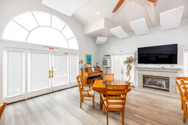 a living room with furniture and a book shelf