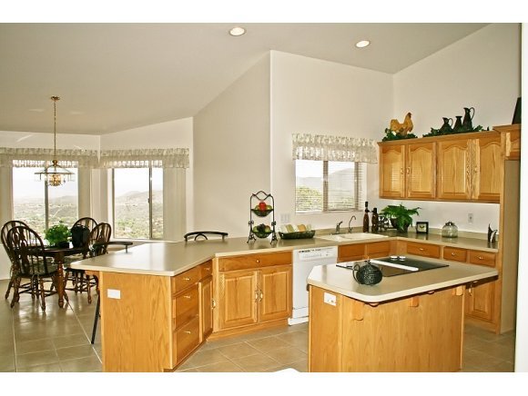 491 Miracle Rider Road Prescott, AZ 86301 - Photo 5 of 20 a dining table seating space with large windows