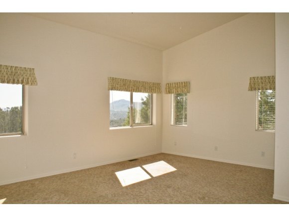 491 Miracle Rider Road Prescott, AZ 86301 - Photo 9 of 20 a view of an empty room with a window