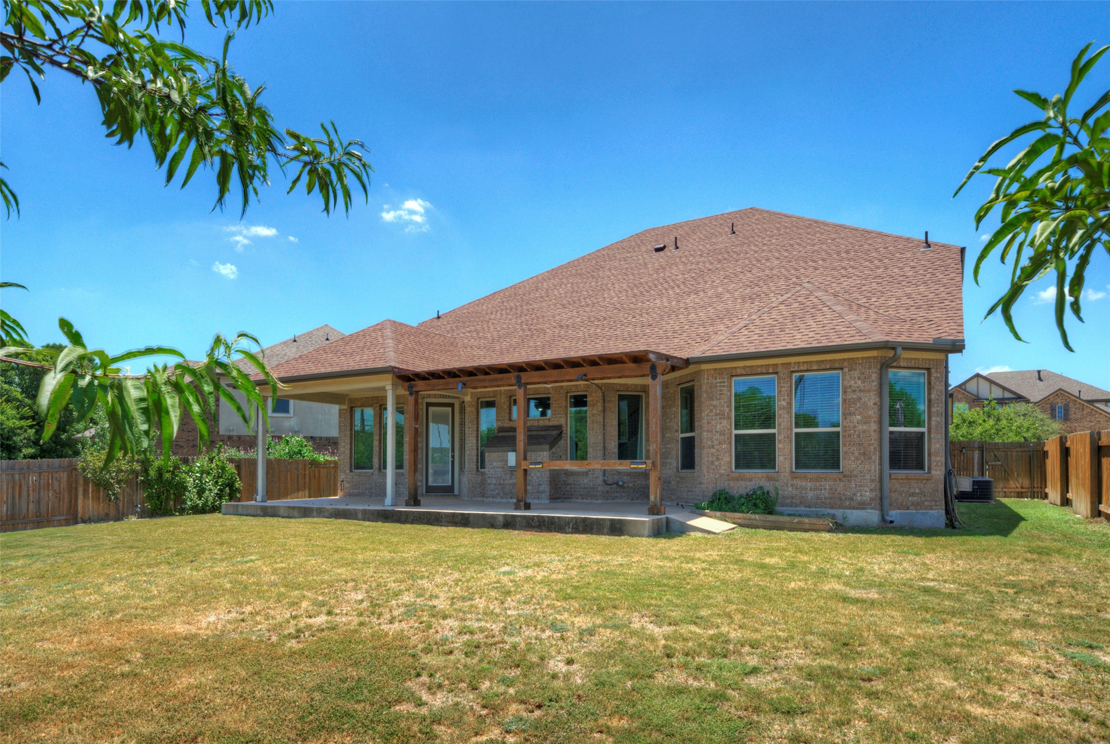2260 Hat Bender Loop Round Rock, TX 78664 - Photo 37 of 40 A generous backyard offers ample space for outdoor living and recreation.