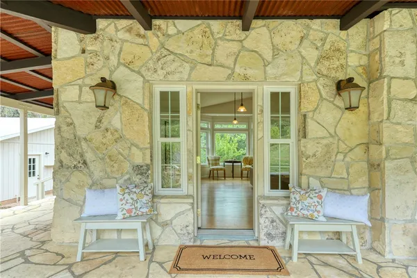 a outdoor living space with a rug