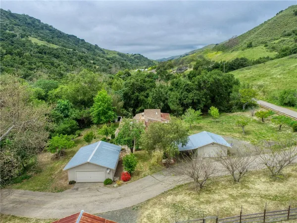 an aerial view of a house with pool