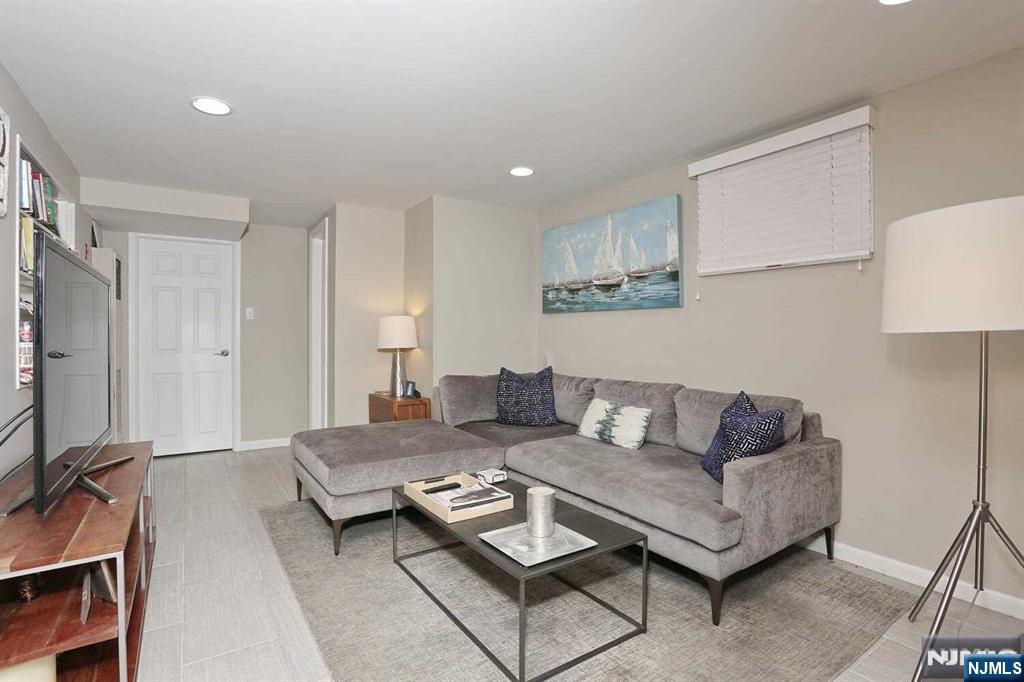 11 Evans Road Cresskill, NJ 07626 - Photo 24 of 31 a living room with furniture and a couch