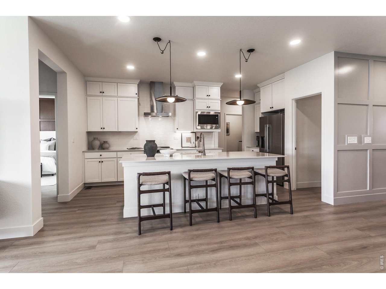 6116 Gault Road Timnath, CO 80547 - Photo 11 of 46 White icing painted maple cabinets with 42" uppers