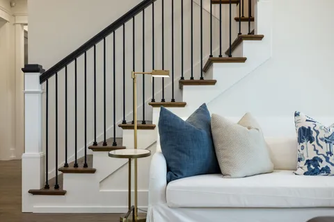 a large kitchen with kitchen island a sink stainless steel appliances and cabinets