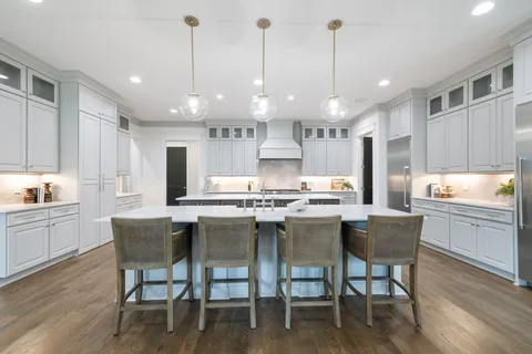 a room with wooden cabinets and a window